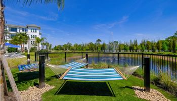 Two hammocks overlooking the water at the preserve at polk apartments